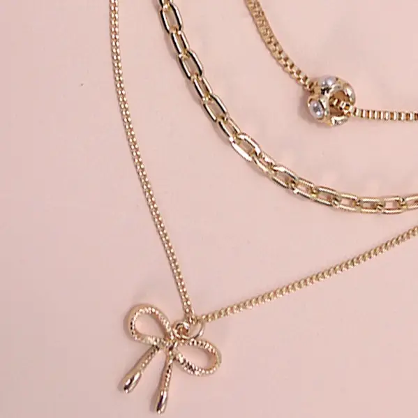 Gold Pearl Bow Necklace